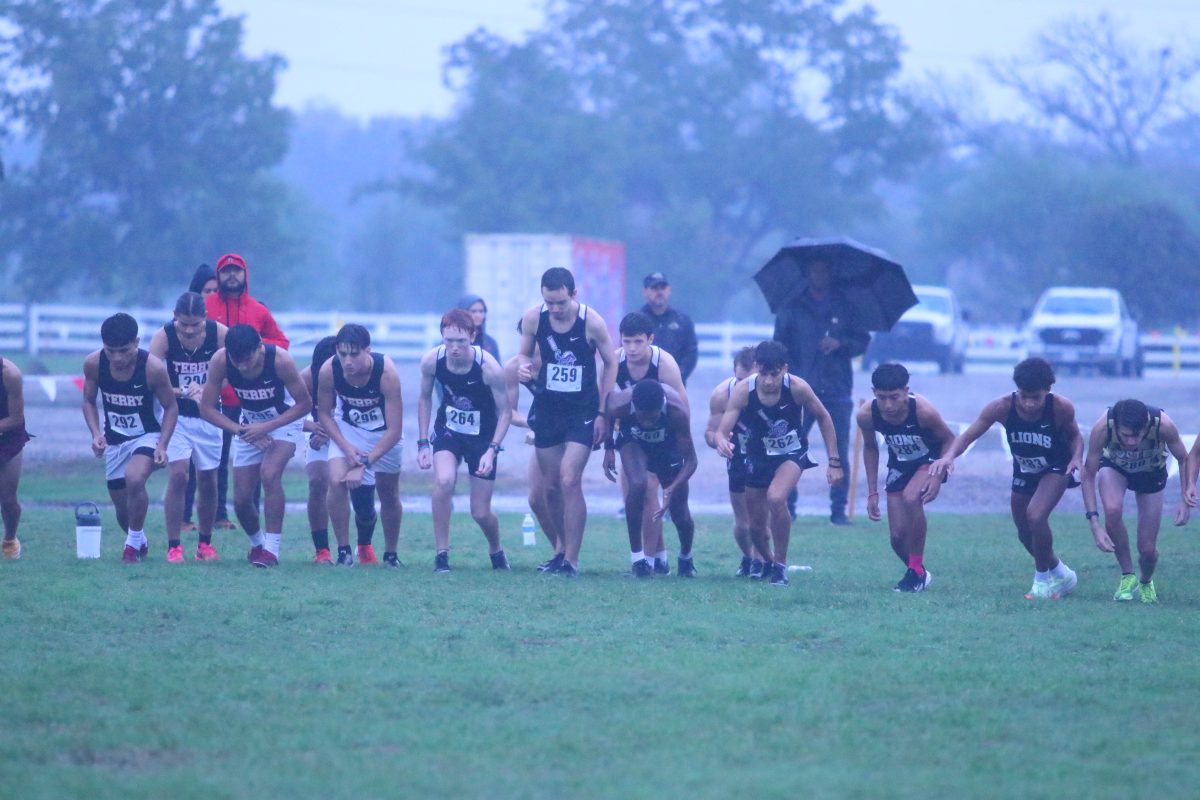 Fulshears Brooks Bryant, Ibrahim Dawelbeit, Adam Knight, and Shepherd Steen line up against other runners in the district cross country meet.