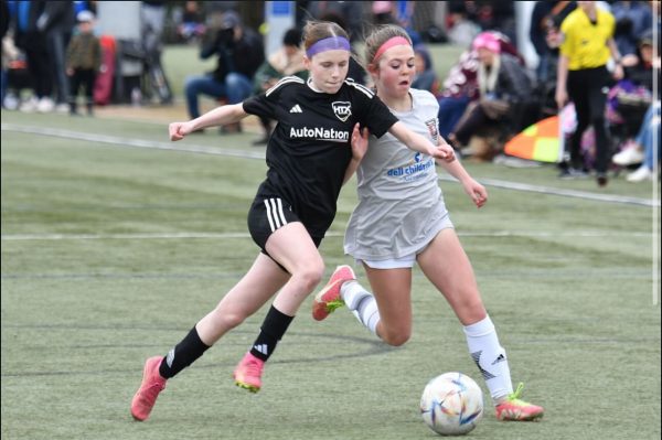 Baylee Schraitle (pictured left) trying to win the ball back. Soccer has been a big aspect of her life that will continue into High School